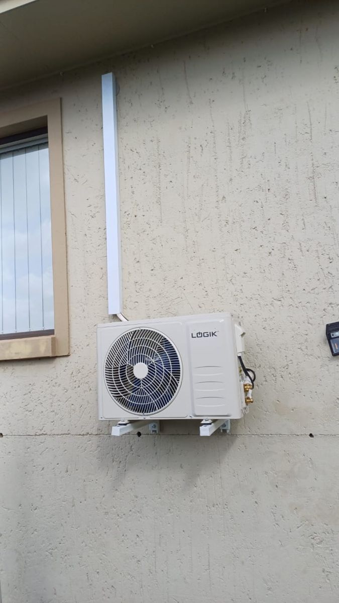 Logik split aircon outdoor unit installed with neat trunking at a Sandton home