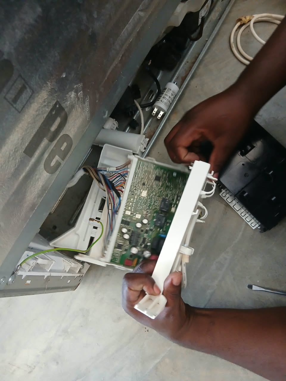 Technician replacing the main control board (PCB) on a Bosch fridge in Midstream, Centurion