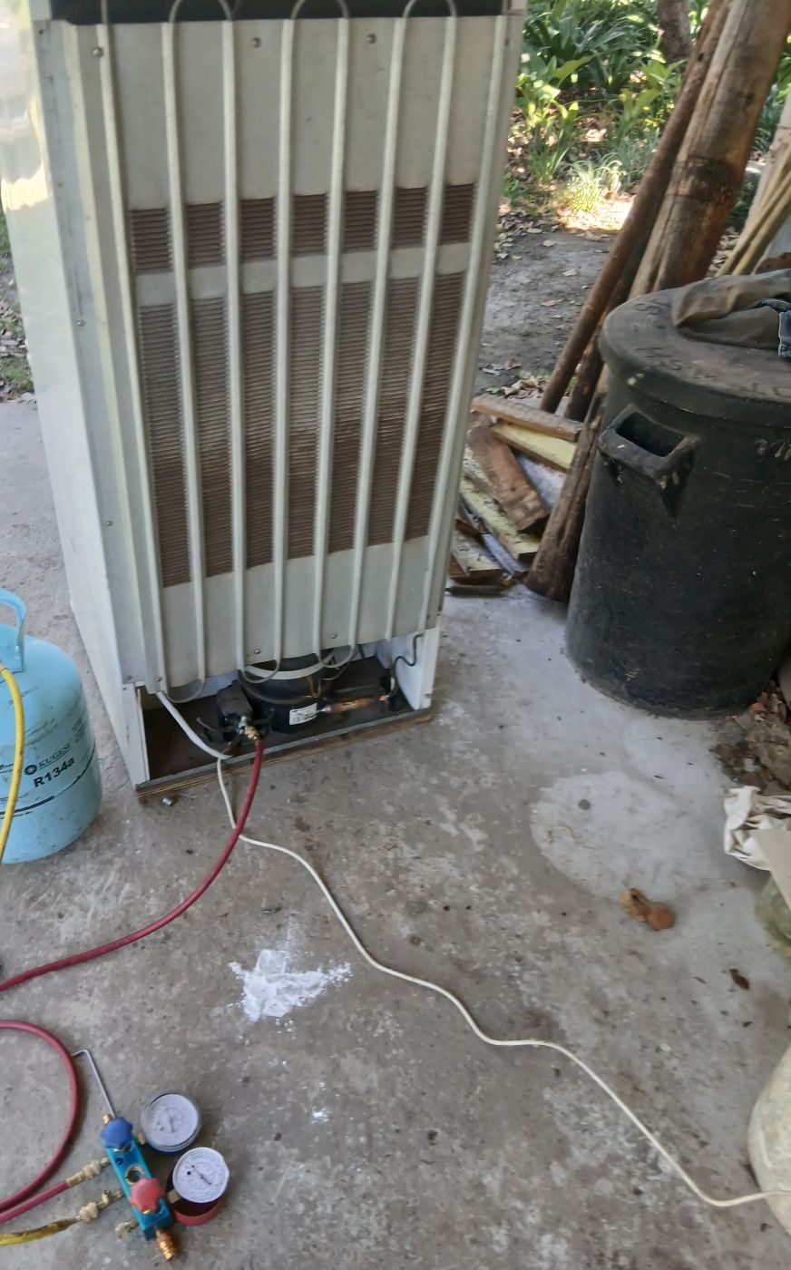 Caravan fridge being regassed after a gas leak repair in Springs