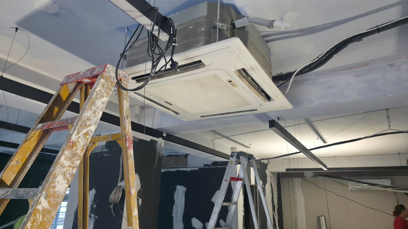 Ceiling cassette aircon being installed in a commercial building in Kempton Park