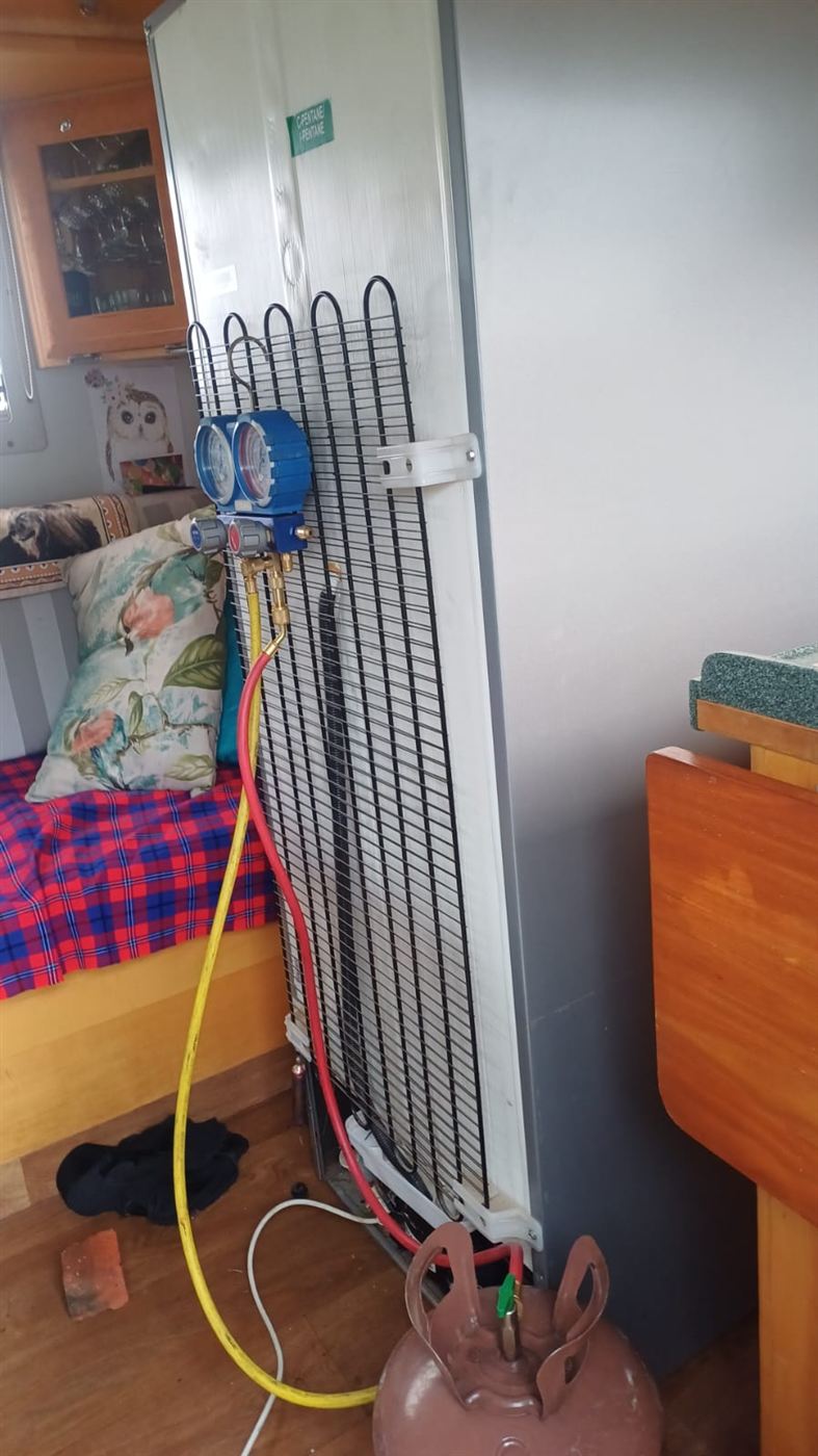 Defy fridge in a camper connected to gauges for a gas leak repair in Rivonia