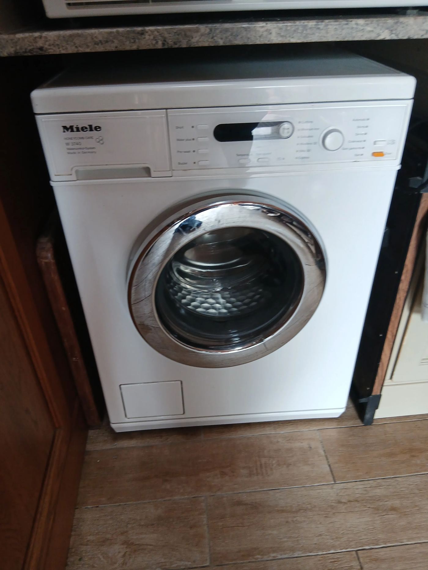 Miele front-loading washing machine, Made in Germany, opened for repair