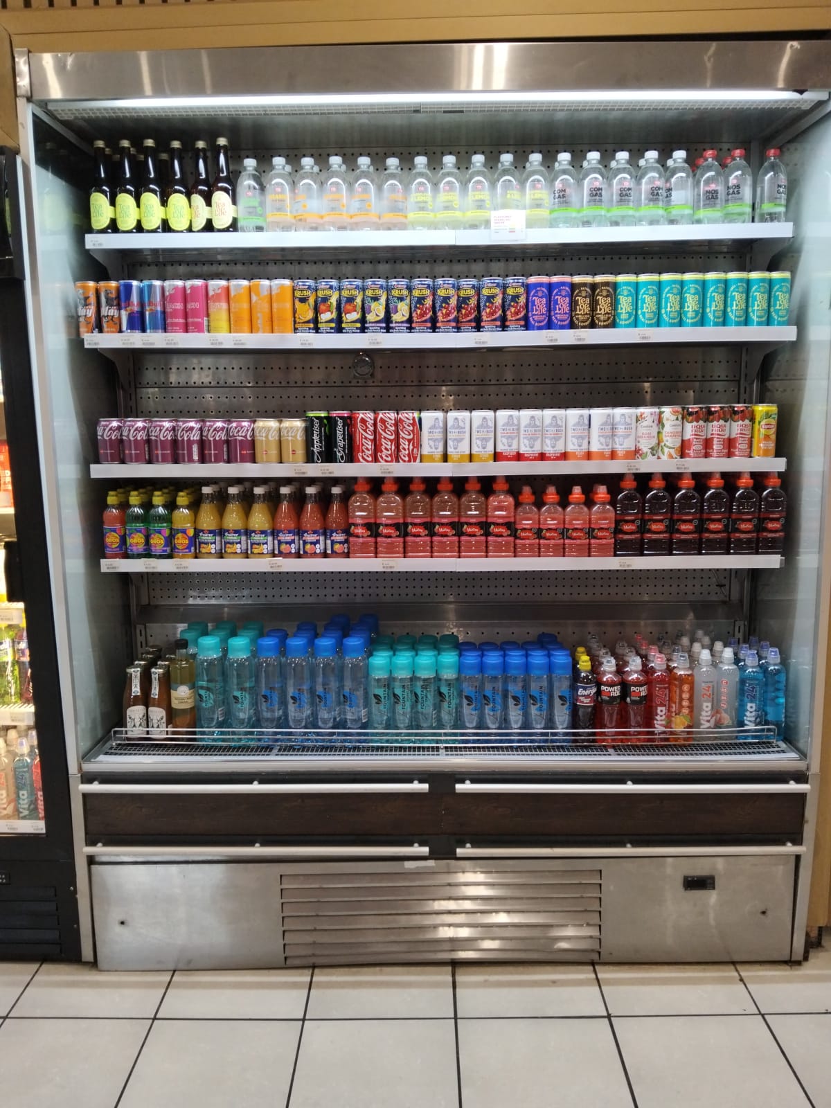 Open-front multideck drinks display fridge at a Pretoria West garage, repaired with a new condenser fan motor