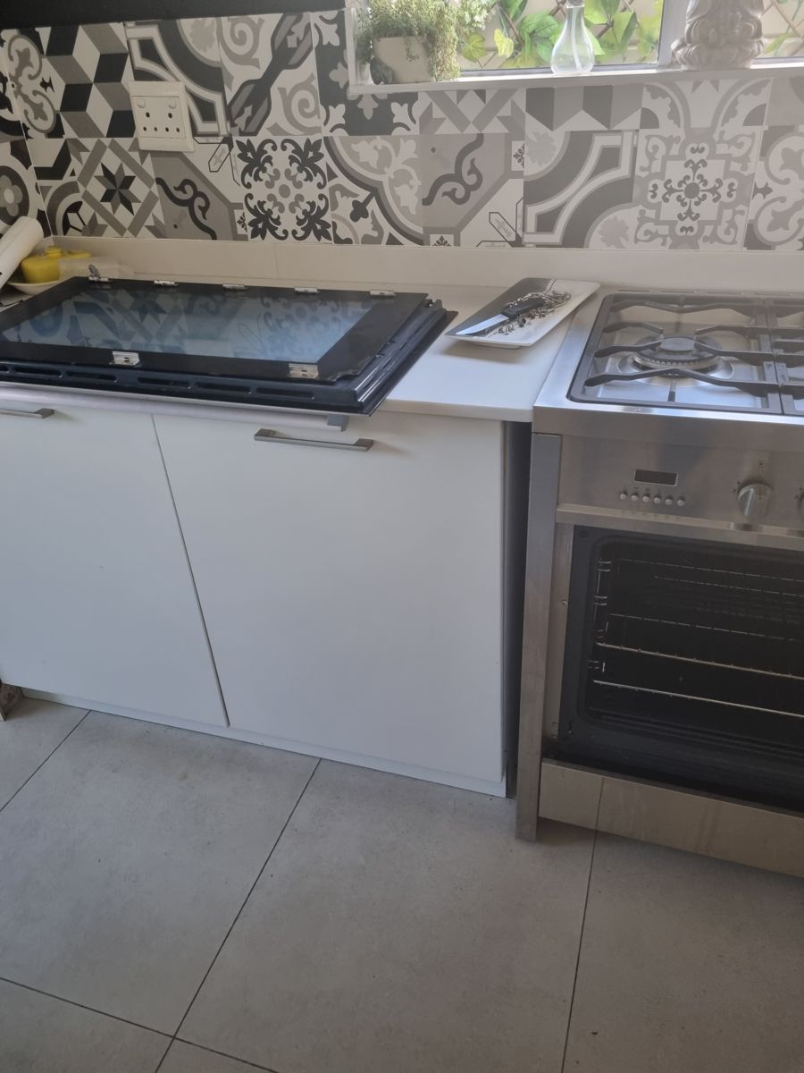Smeg range cooker in Fourways with the oven door removed for a hinge repair