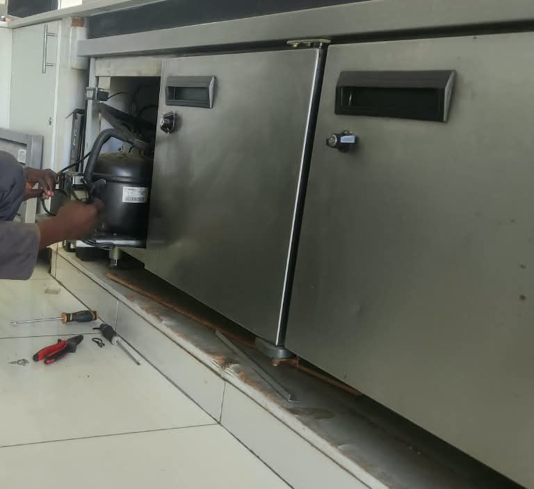 Compressor being replaced on a commercial undercounter bar fridge in Midrand