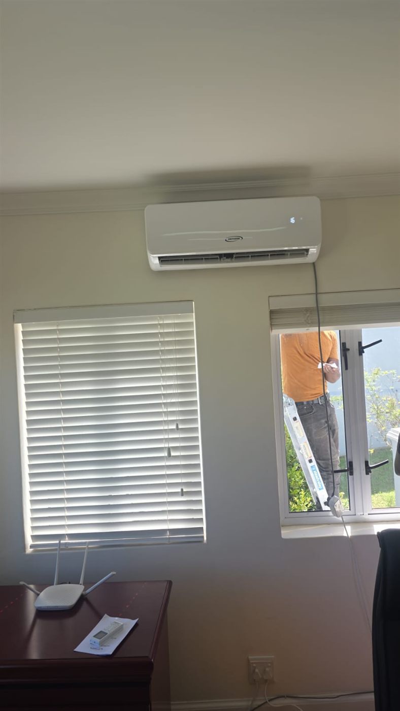 Unitherm split aircon installed above the window in a home office in Essexwold